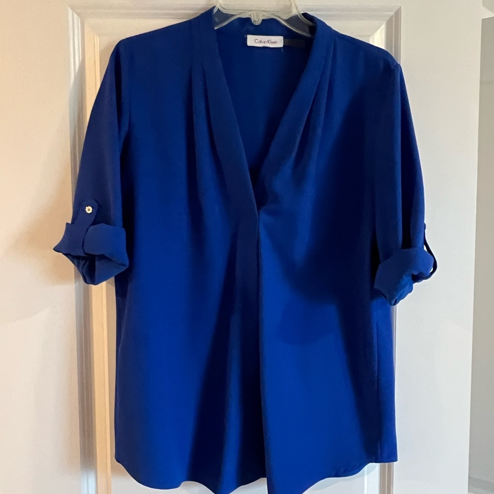 Calvin Klein blue polyester and spandex top.